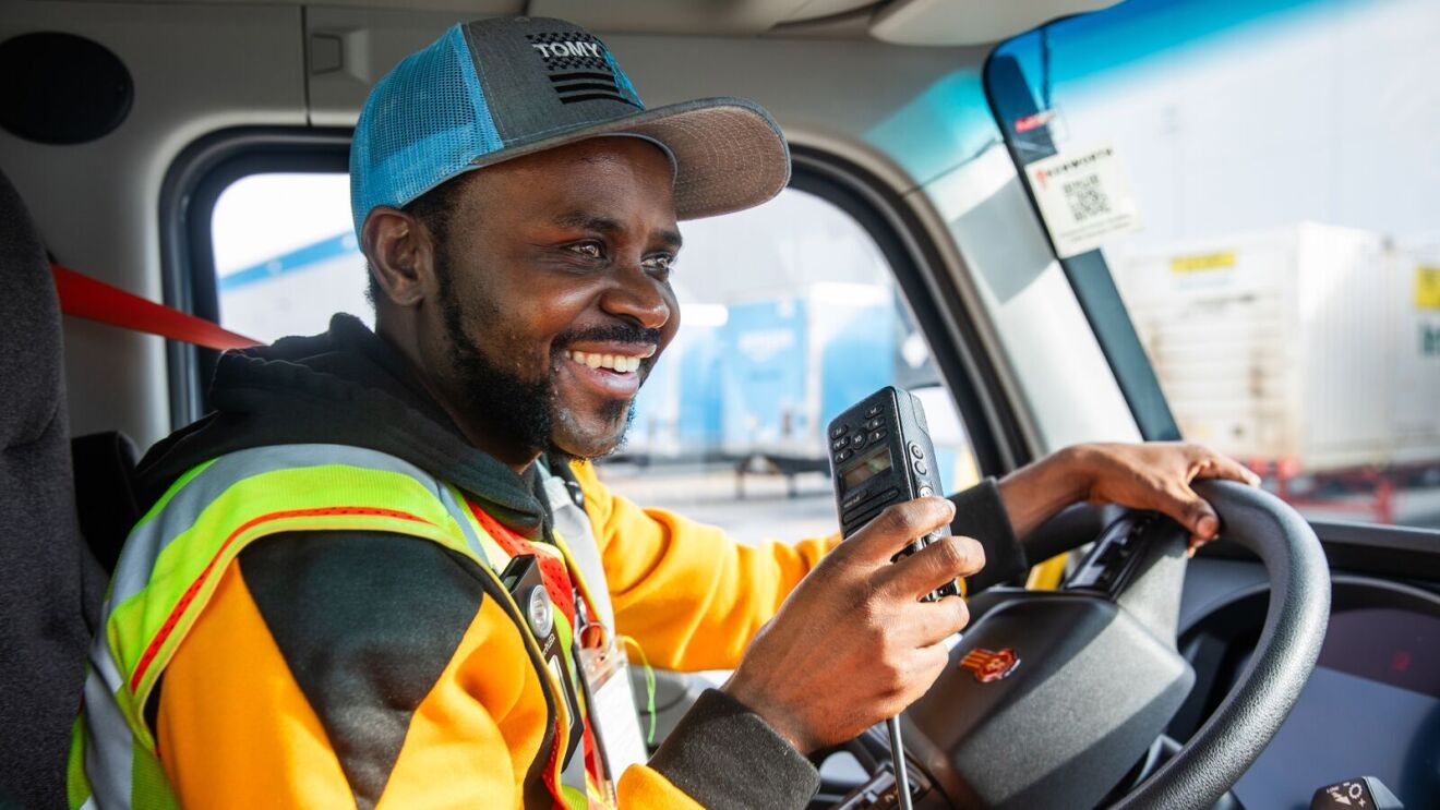 Tuyisenge in the cab of one of the Amazon trucks.