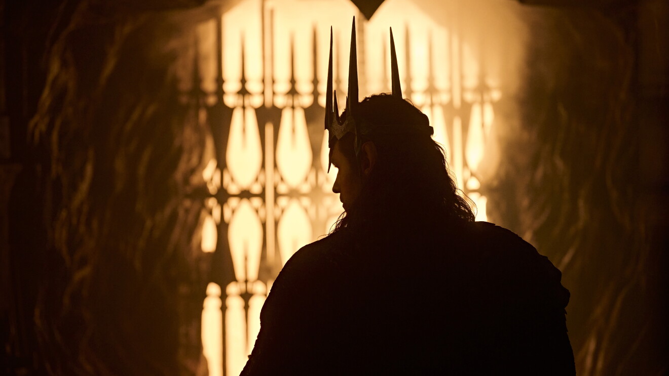 Amazon Upfront, The Lord of the Rings: The Rings of Power; Silhouetted figure wearing a spiked crown standing before illuminated candelabras