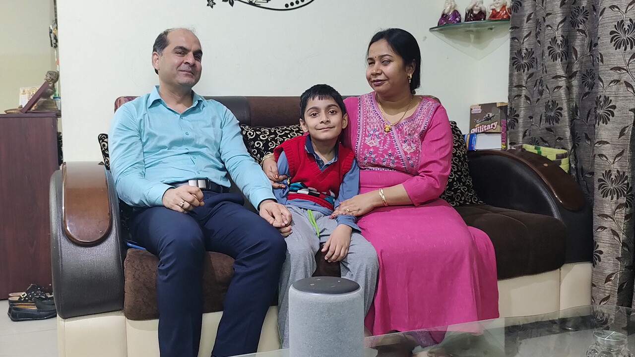 Blind couple - Gauri & Parvesh, sitting on a couch with their son Arsh
