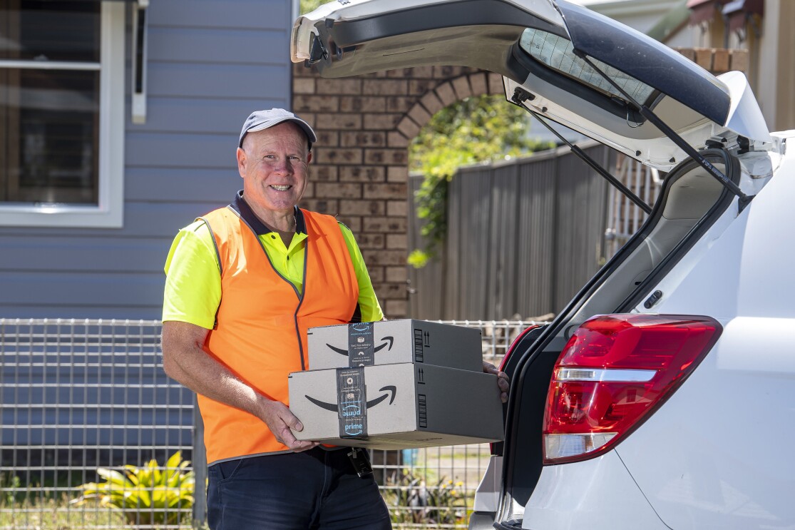 Amazon Flex Delivery Partner - Steve holding Amazon boxes