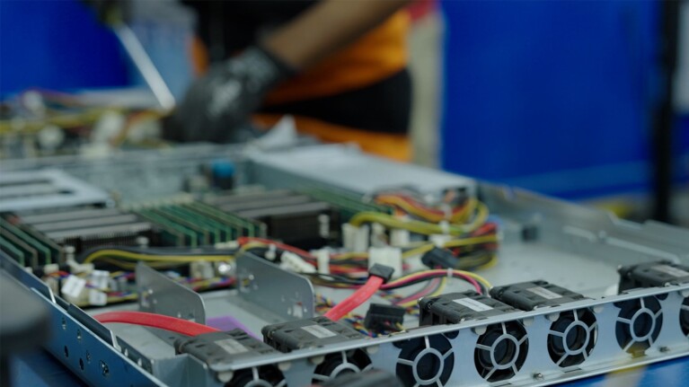 A photo of an AWS server racks being demanufactured.