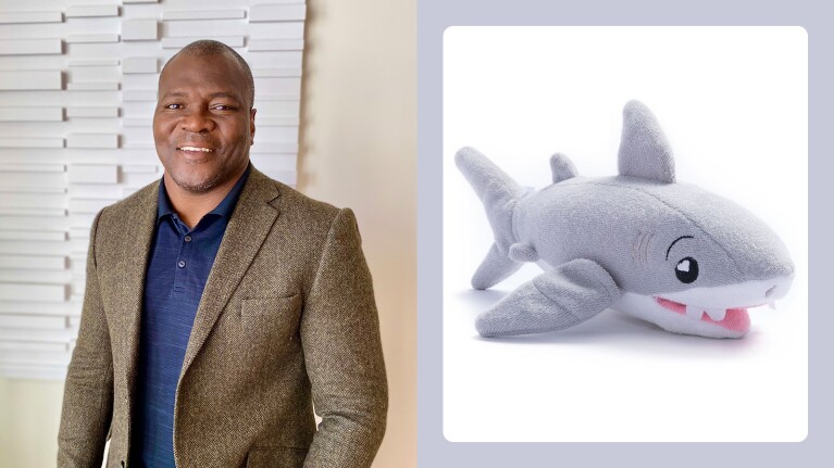 small businesses featured in Oprah’s Favorite Things 2024 holiday gift list: man posing with a toy shark on the right