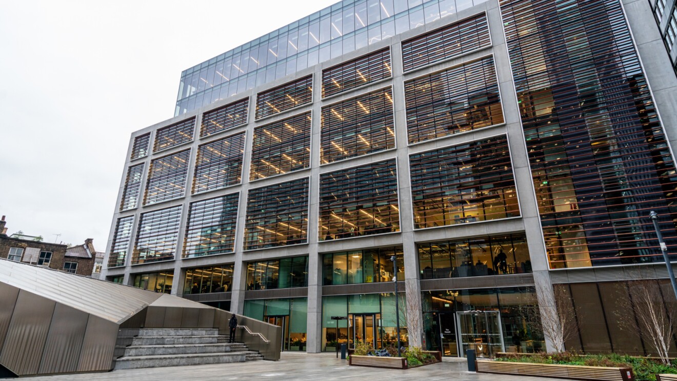 Modern Amazon office building in London with glass facade and illuminated interior