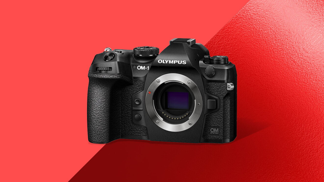 Olympus OM-1 camera body on red background
