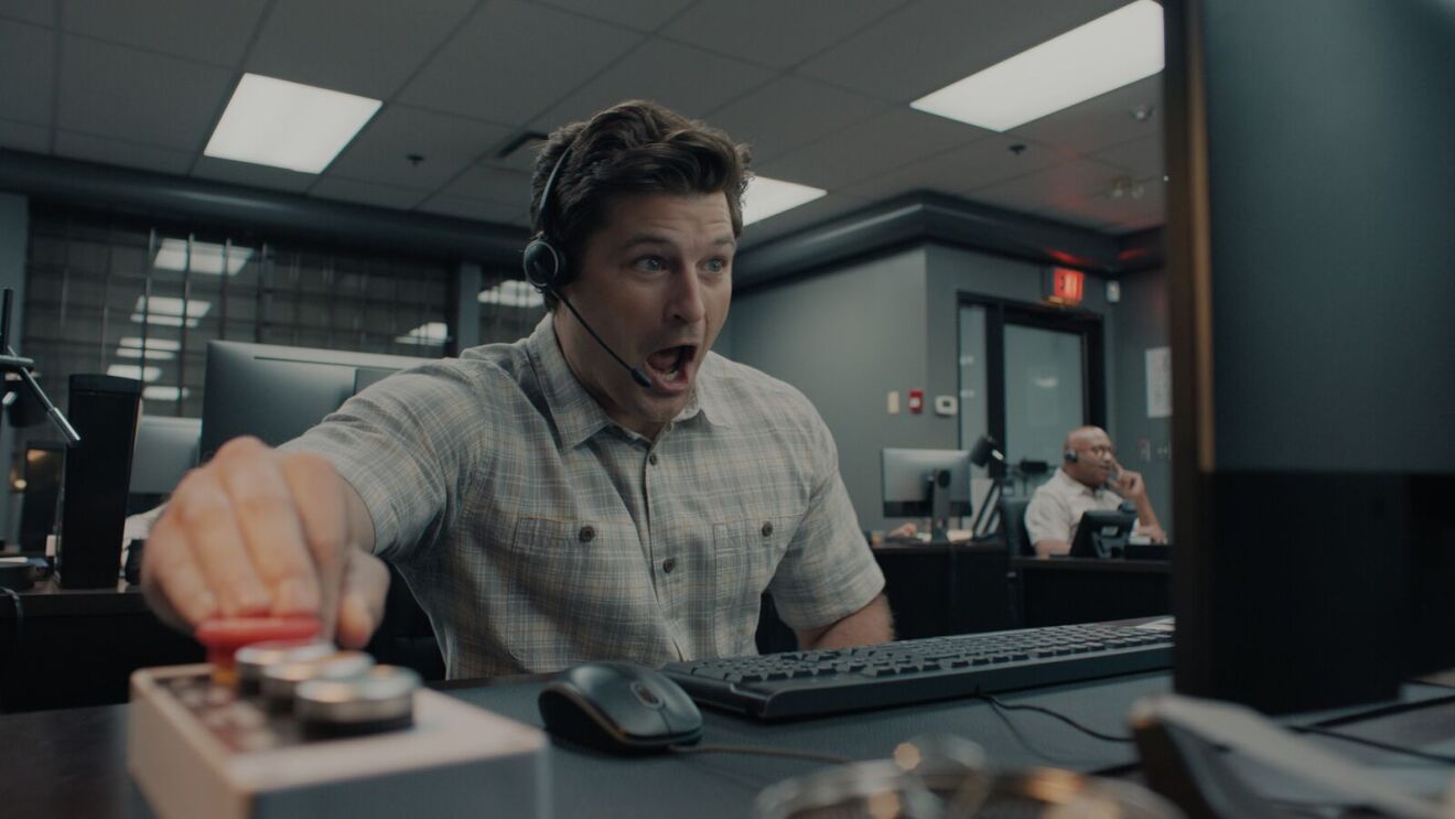 A man sits at a computer