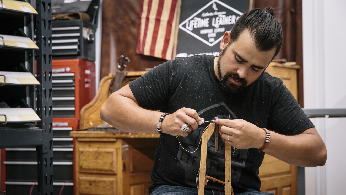 A man works in his shop.