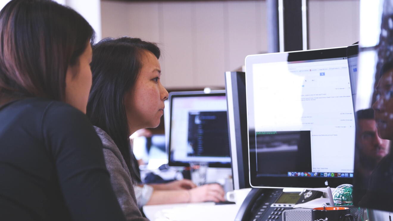 Women working on computer, coding 