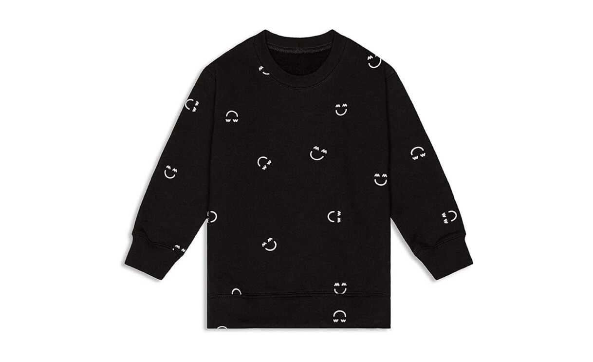 A product image of neutral baby clothes from Miles and Milan.