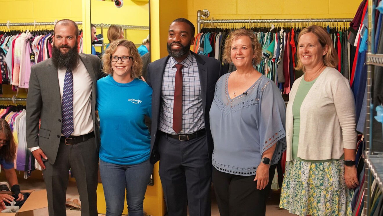 Amazon employees surprise nonprofits and schools with donations of various items.