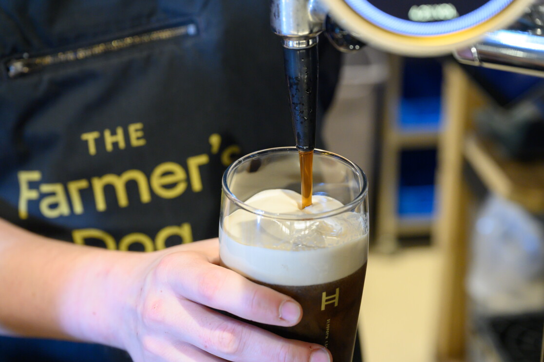 A pint of stout is poured at The Farmer's Dog in Burford, Jeremy Clarkson's proper British pub from Clarkson's Farm season 4