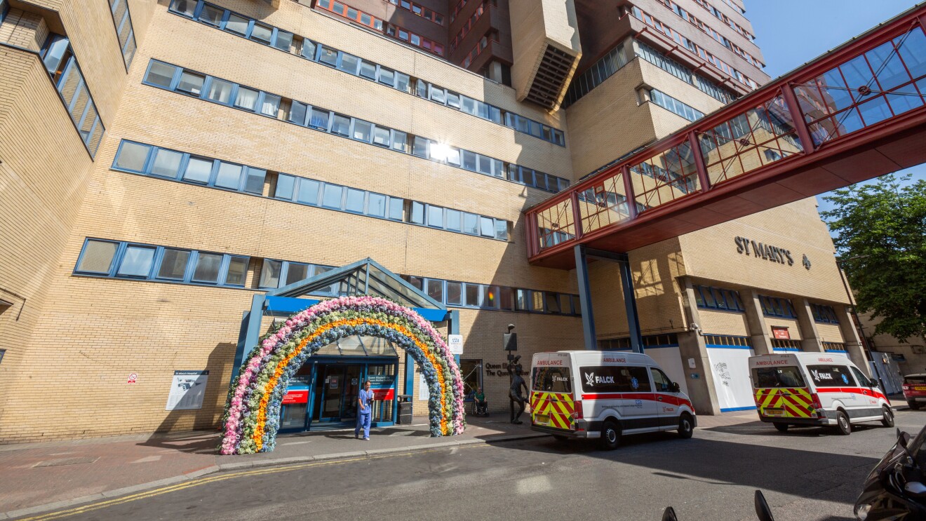 Front of St Mary's hospital with flowers around the door