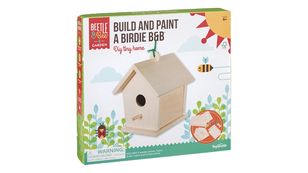 An image of a box with a wooden bird house on it and product labeling