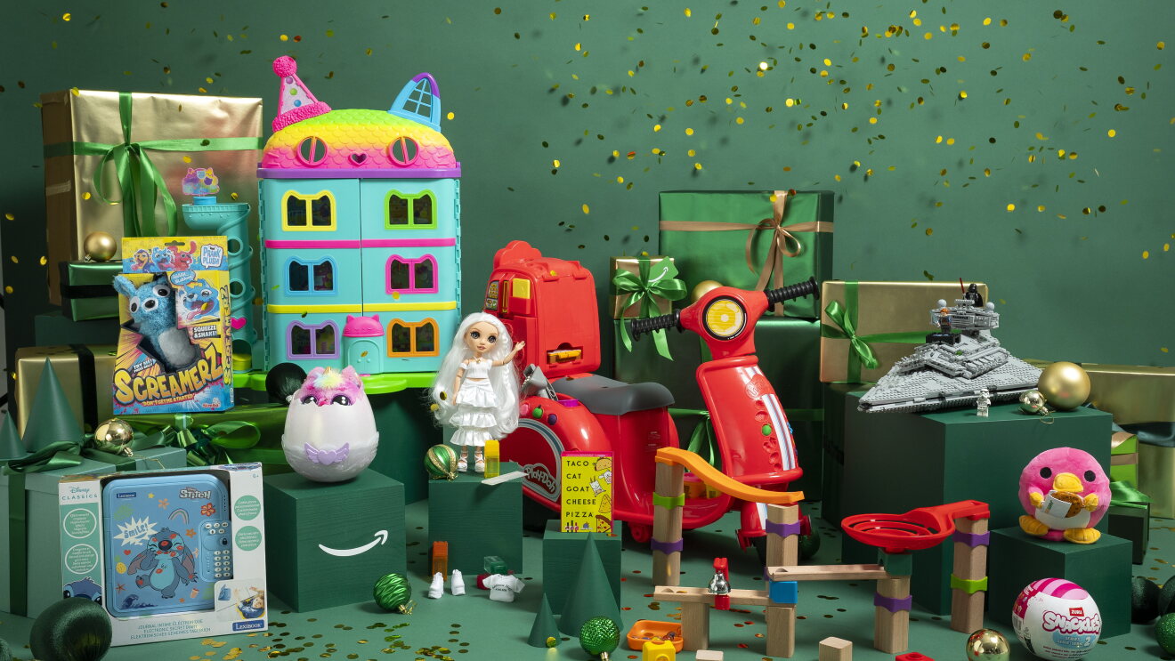 The toys featured in Amazon Top Ten Toys lists surrounded by christmas packaging 