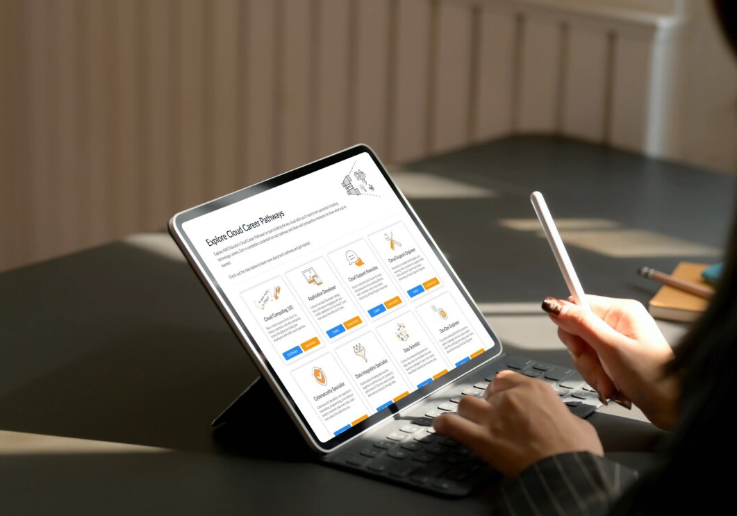 Someone accessing AWS educate from their tablet computer, they are also holding a stylus. 