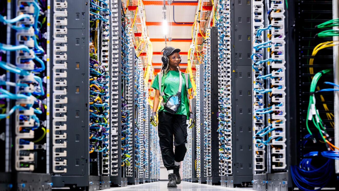 Women walking inside a data center
