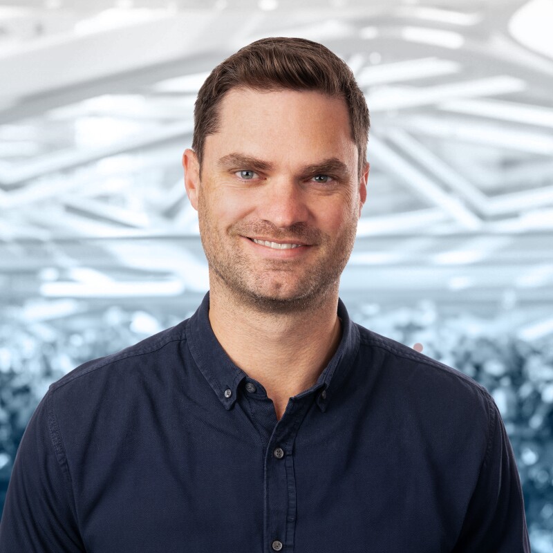 A headshot of Ryan Redington