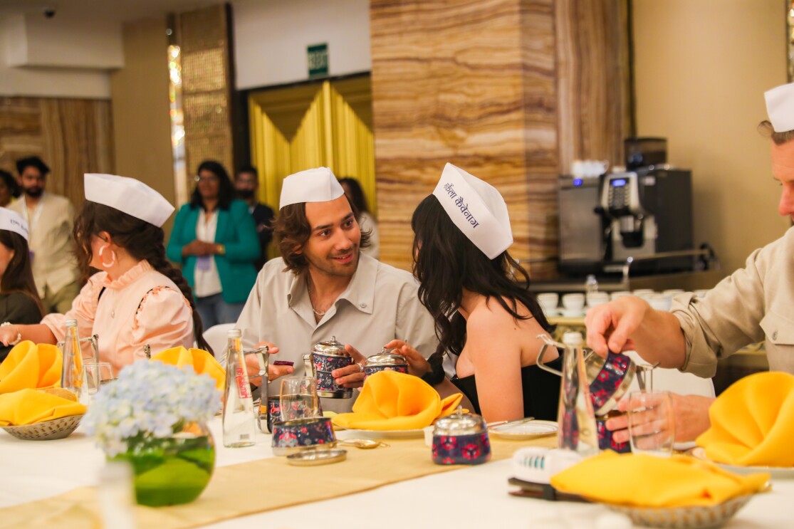 The crew break bread with Mumbai's Dabbawallas