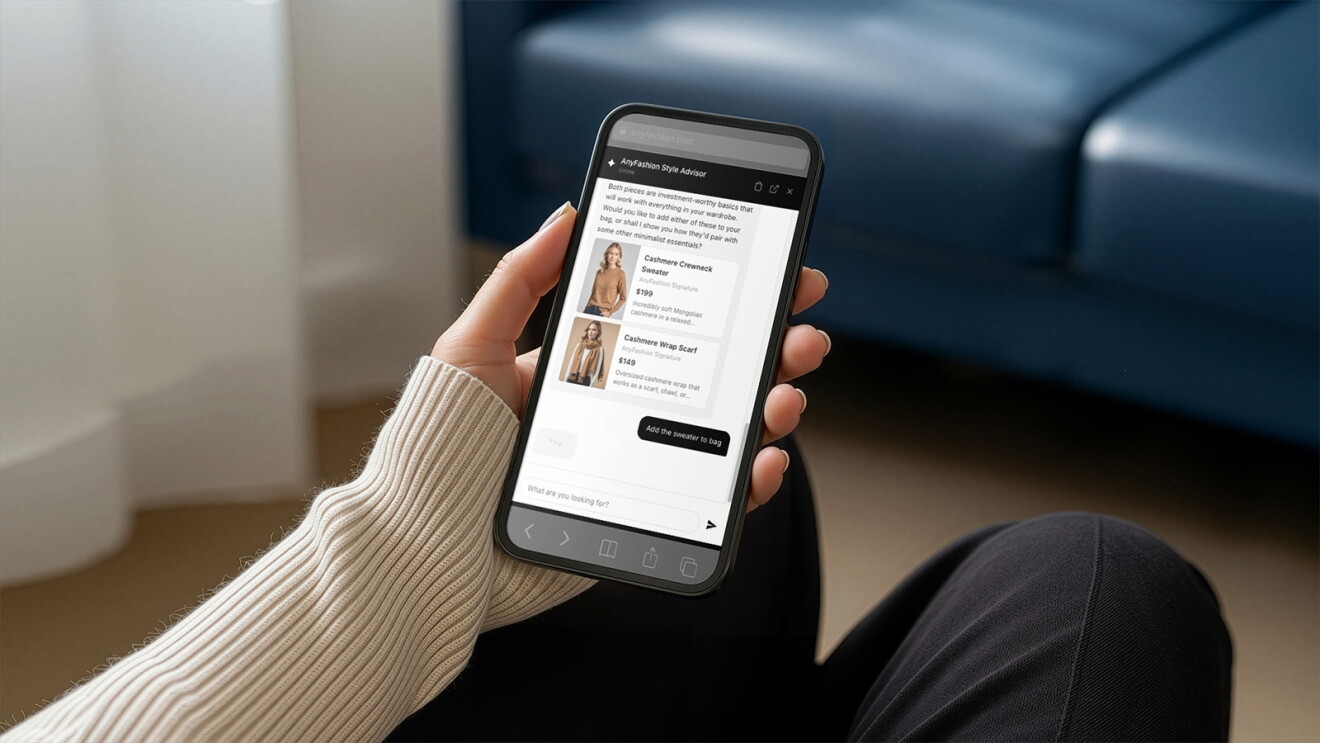 Person holding smartphone displaying fashion style advisor app with clothing recommendations utilizing AWS Agentic Shopping Assistant (ASA)