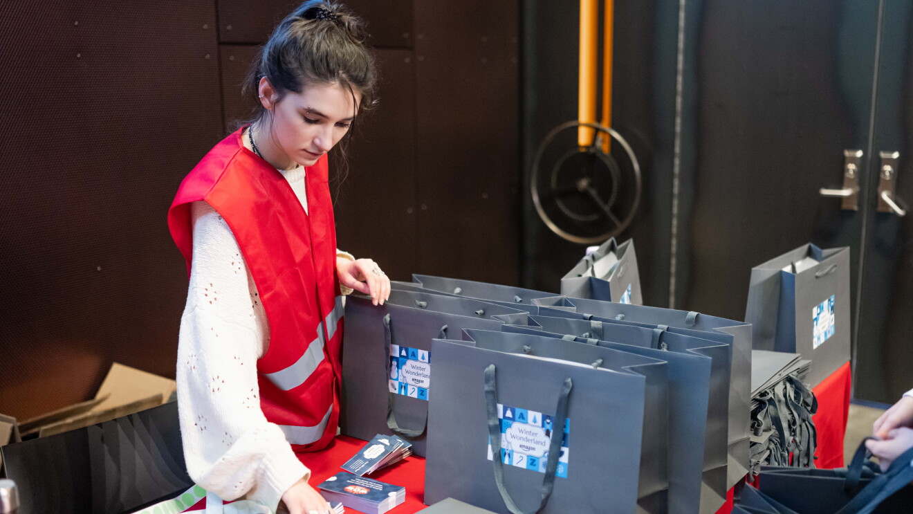 Amazon’s Winter Wonderland: volunteer packing gift bags for event
