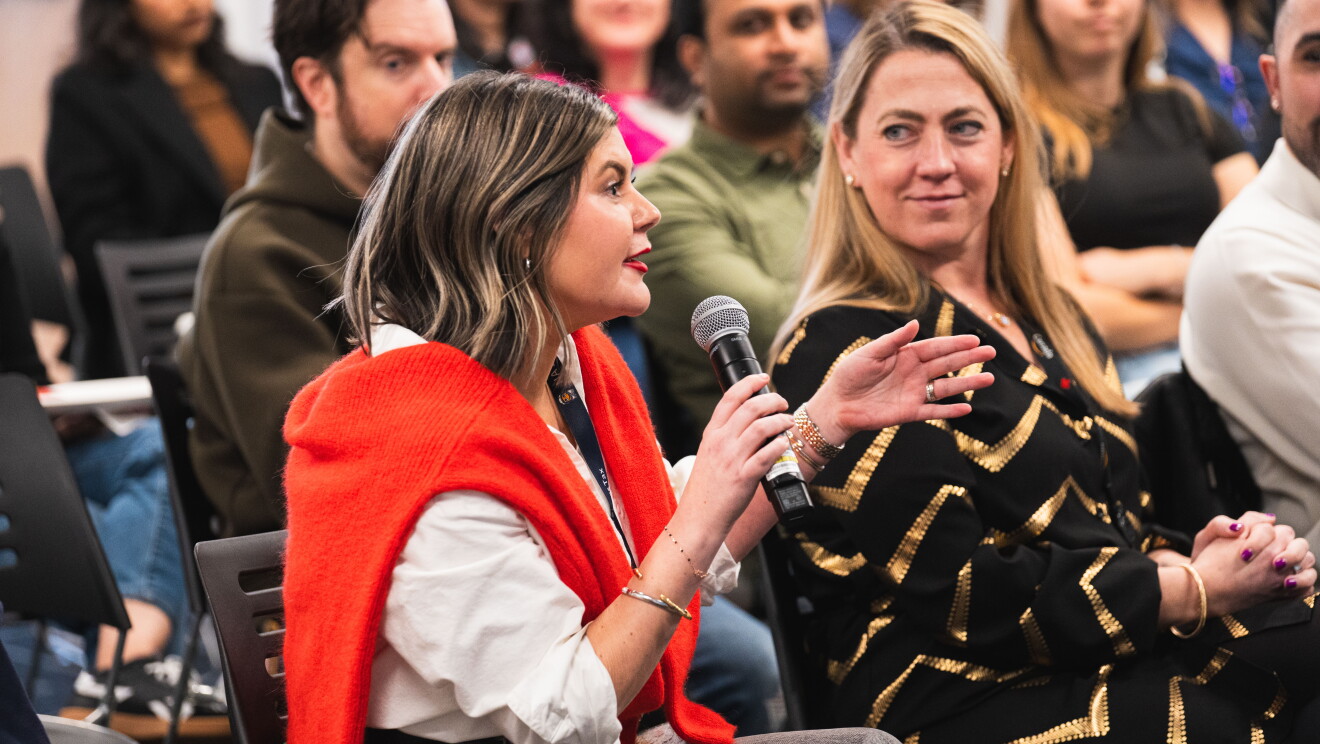 women speaking at event 