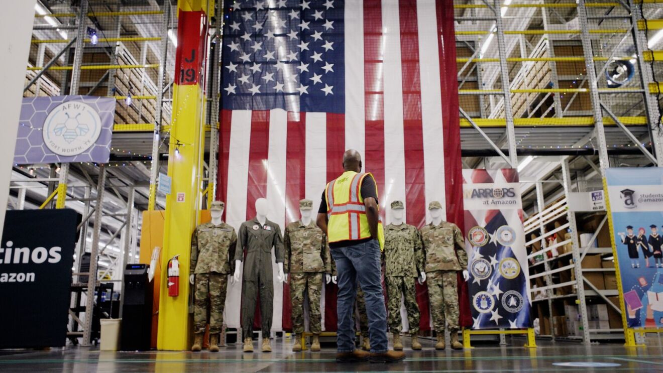 Amazon facility with American flag and military display