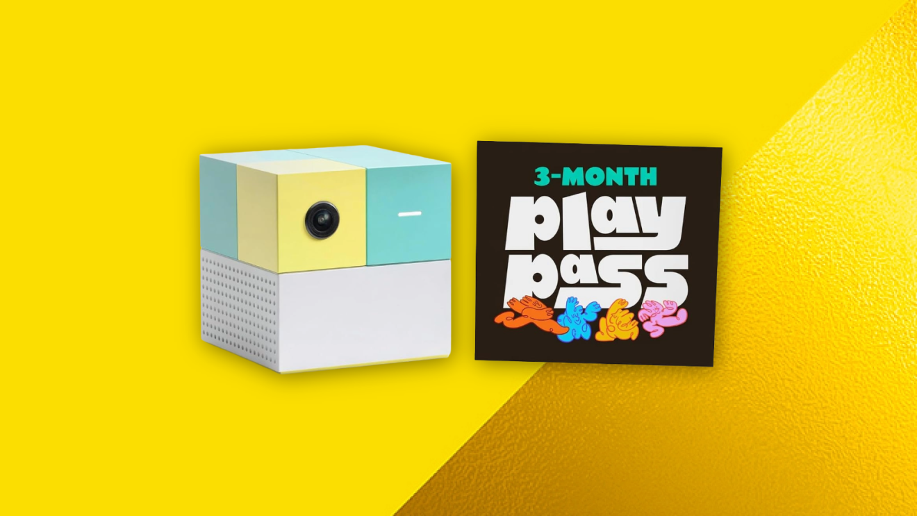 Colorful cube-shaped projector next to a 3-month play pass card on yellow background