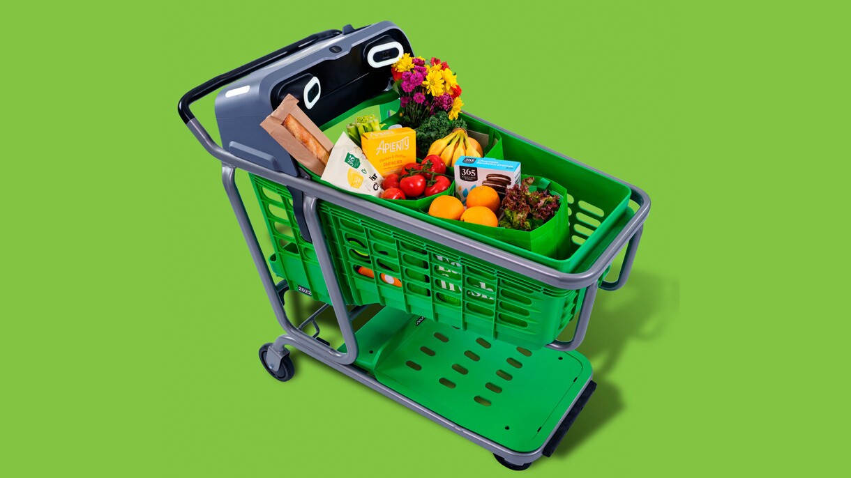 An image of the Amazon Dash cart against a green background.