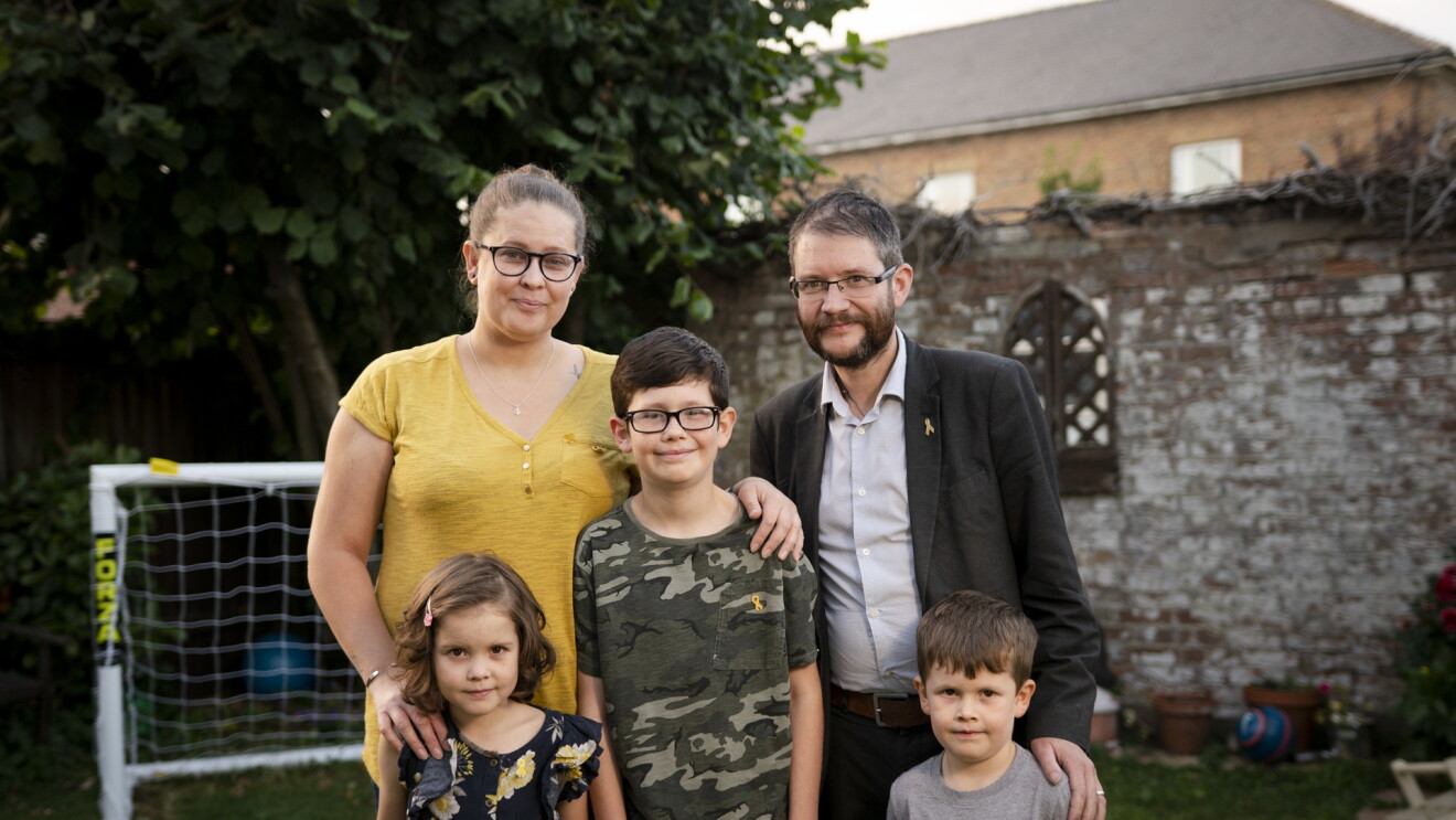 The Hay family, four people, with little Kayla and her brothers, in their garden