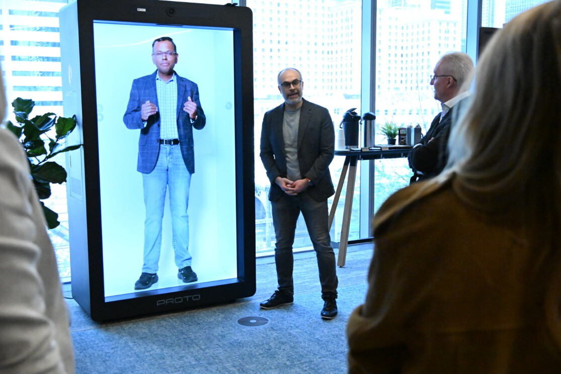 man standing in front of immersive screen