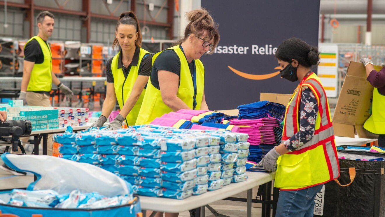 Amazon employees packing relief kits in a Disaster Relief Hub.