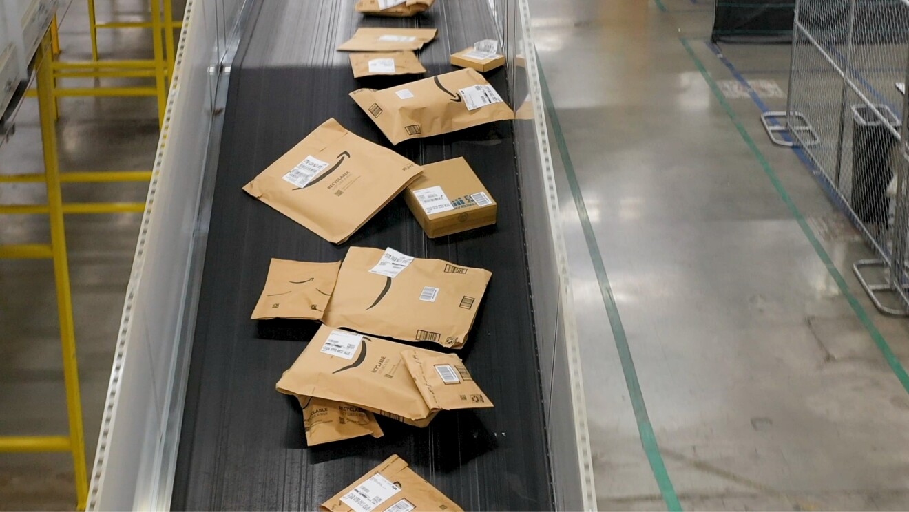 Packages on conveyor belt in warehouse