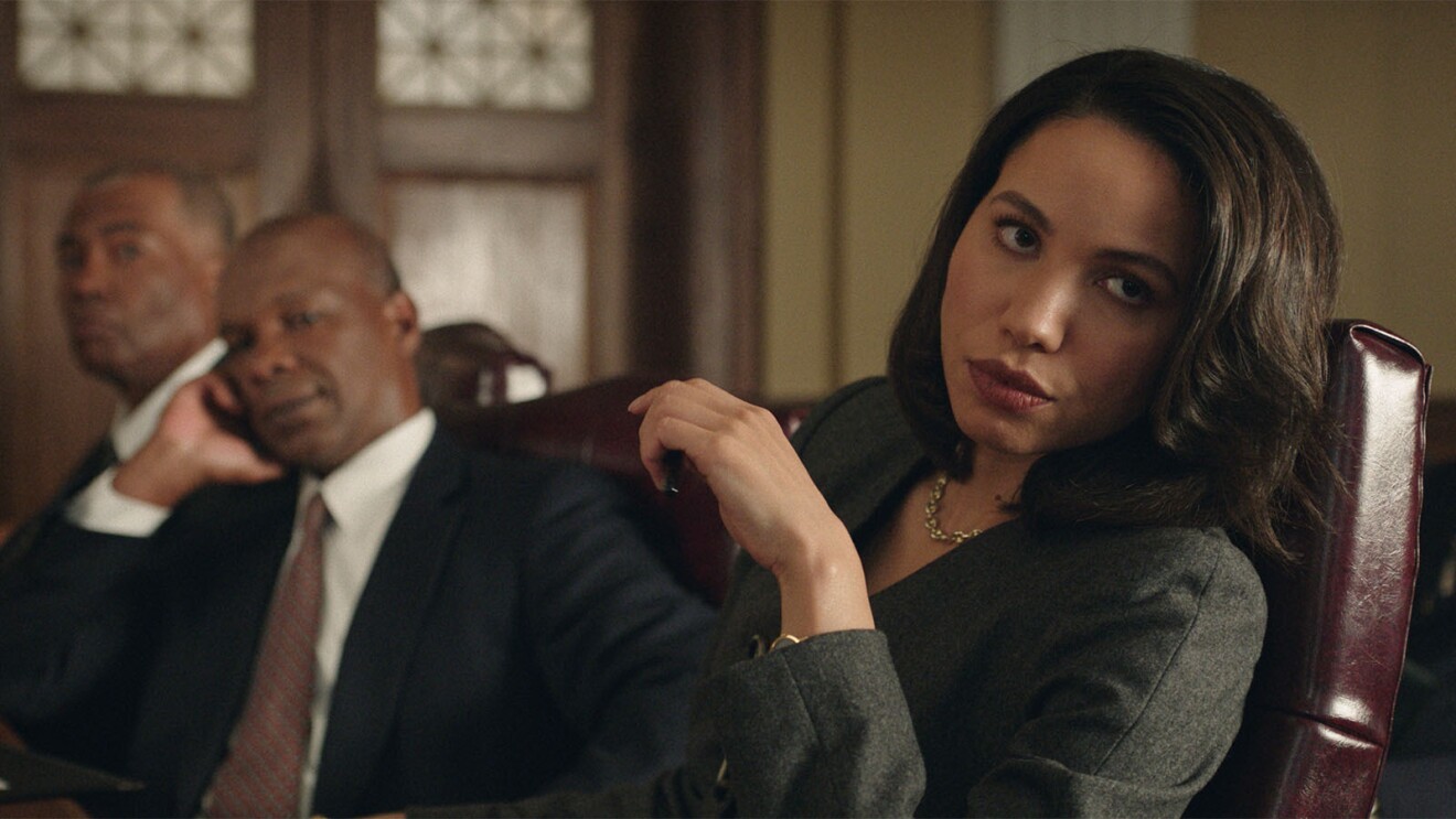 Gralen Bryant Banks, Doug Spearman, and Jurnee Smollett sitting in a trial room in the movie, The Burial.