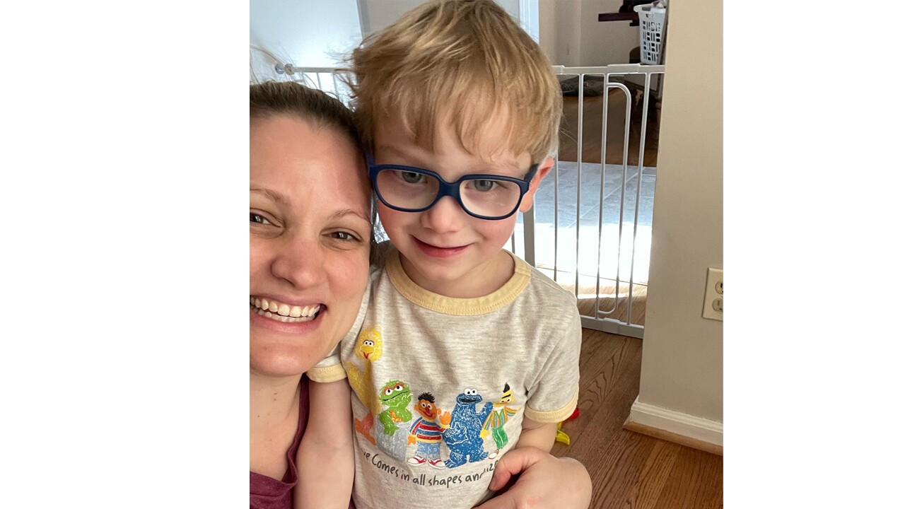 An image of a mother and her son smiling for a selfie photo.