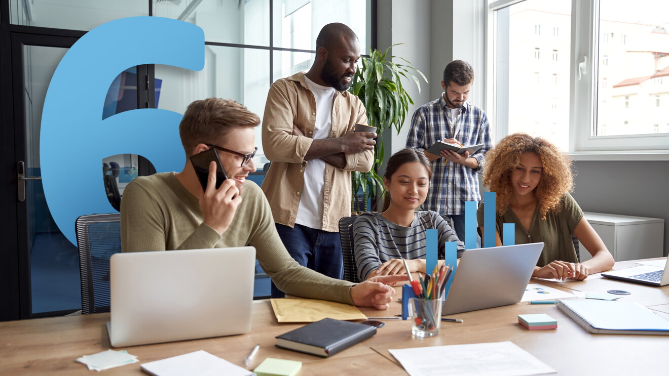 A photo of a team working in a conference room with a number six illustration in the background.