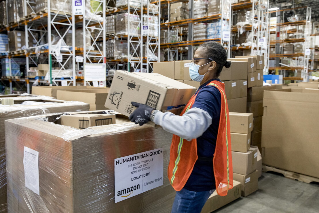An Amazon employee prepares products for distribution at the Amazon Disaster Relief Hub in Atlanta, Georgia. 