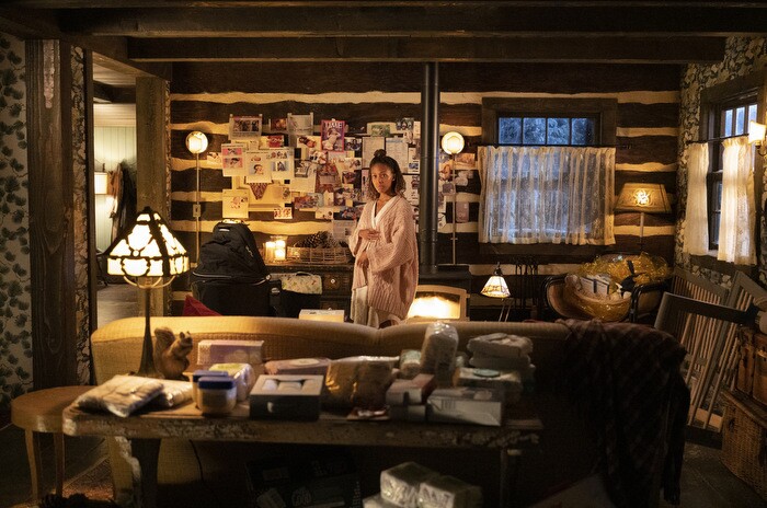 An image of Nicole Beharie on the set of her SOLOS episode. She is in the character's home and holding her belly signaling that she is pregnant.
