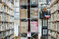 Massive shelves in Amazon fulfilment centre with man on lift retrieving items