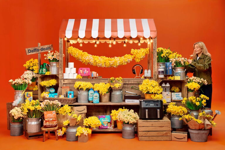 A fair market stall selling yellow flowers