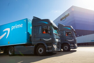 Electric HGV's in front of an Amazon vehicle