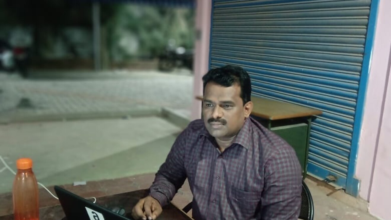 A service partner working on his laptop
