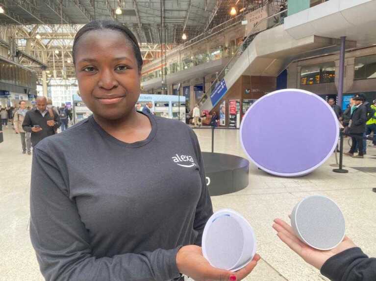 Woman holding Echo Pop speaker