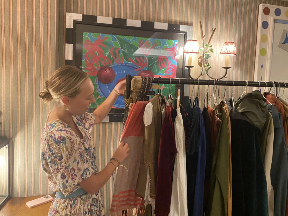 A clothing rack showing a range of costumes 