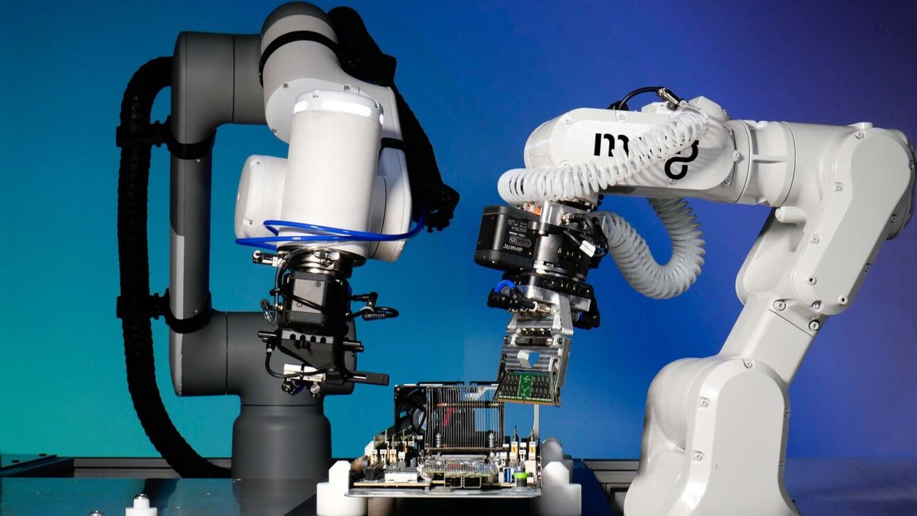 Two robotic arms examining electronic components on a workbench by MOLG