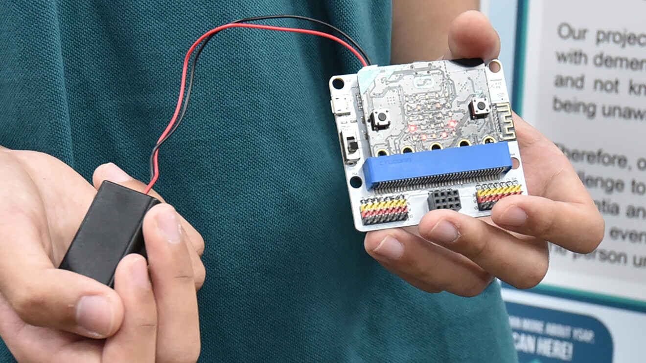 Students participate in a science fair experience through amazon.sg robotics program