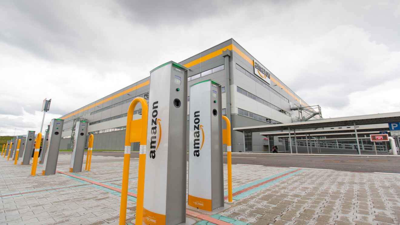 An electric car charging station outside of an Amazon fulfillment center in Italy.
