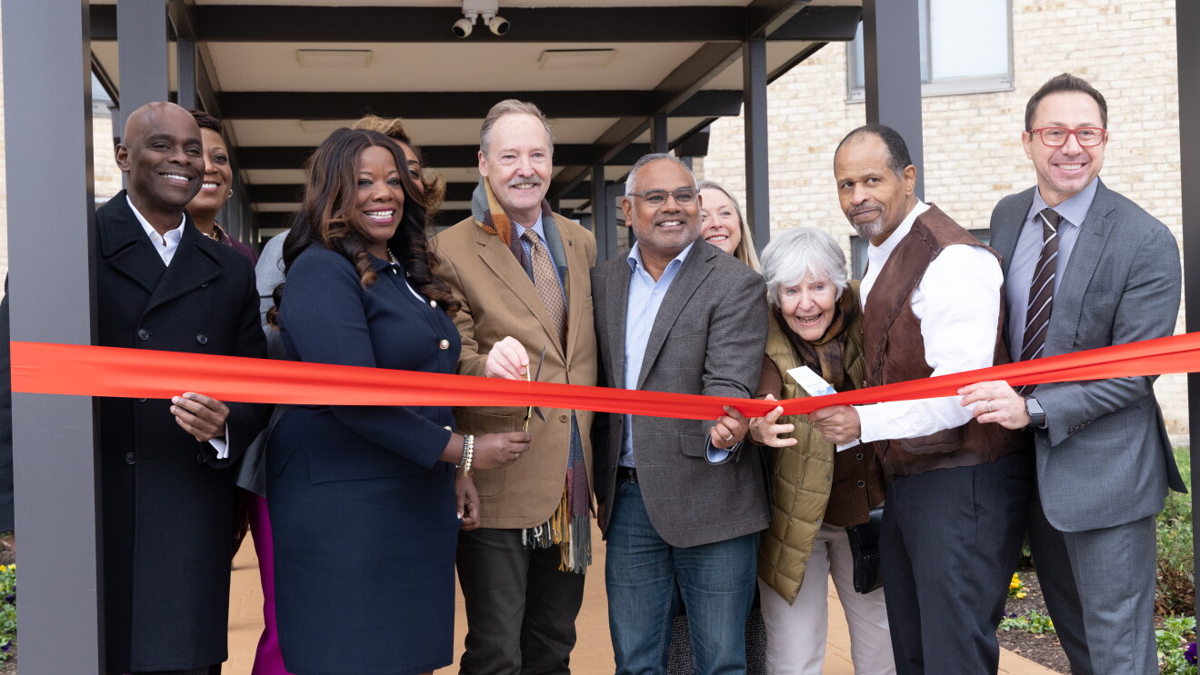 Community leaders celebrate grand opening with red ribbon