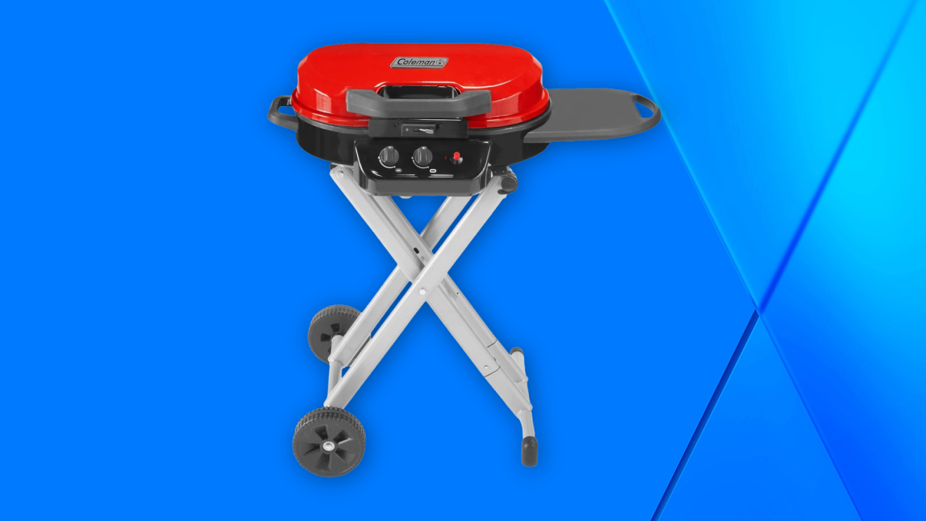 Coleman portable propane grill with red lid and collapsible stand with wheels