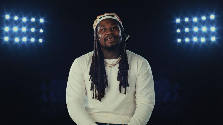 Former NFL running back Marshawn Lynch speaks during interview.
