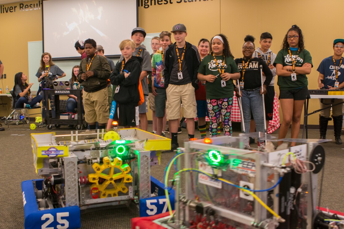 Students participate in a Camp Amazon event at a fulfillment center in Washington