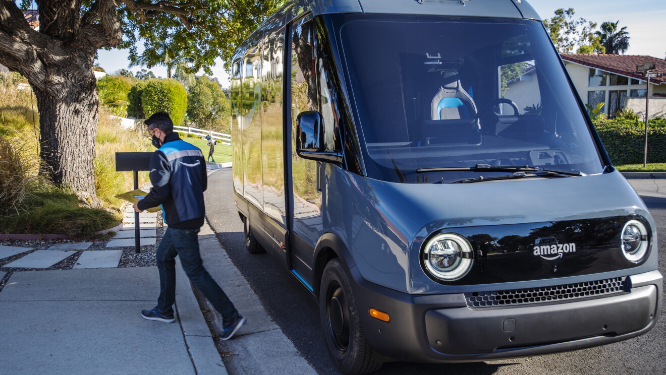 An Amazon delivery driver parks at the end of a driveway to delivery a package.